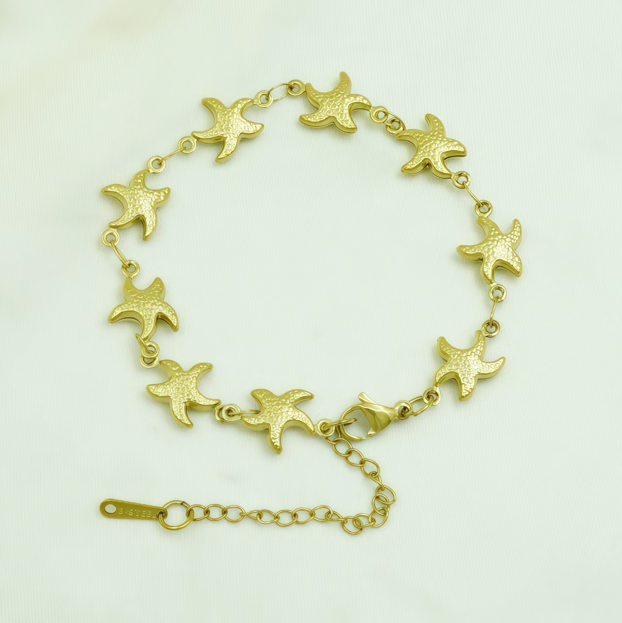 Cross border stainless steel hollow plated 18k gold starfish bracelet from Europe and America