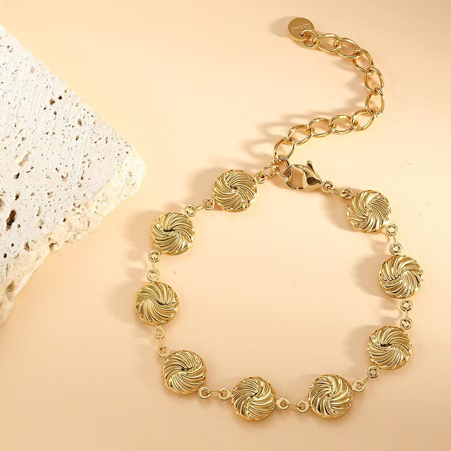 Cross border stainless steel hollow plated 18k gold spiral bracelet from Europe and America