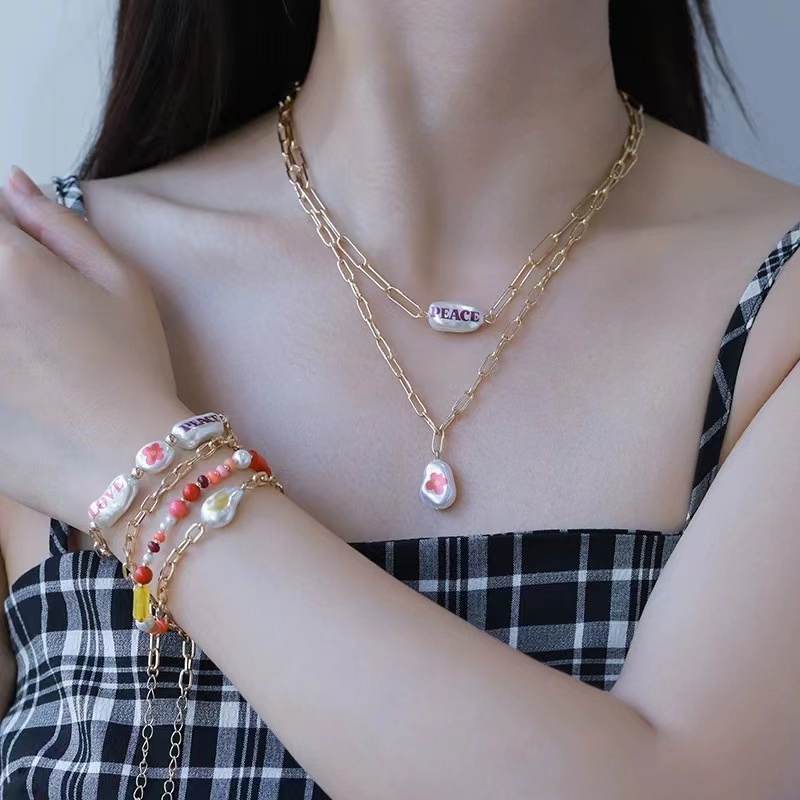 Colored printed pearl overlapping necklace, European and n Fashion String Pearl Heart Pendant set