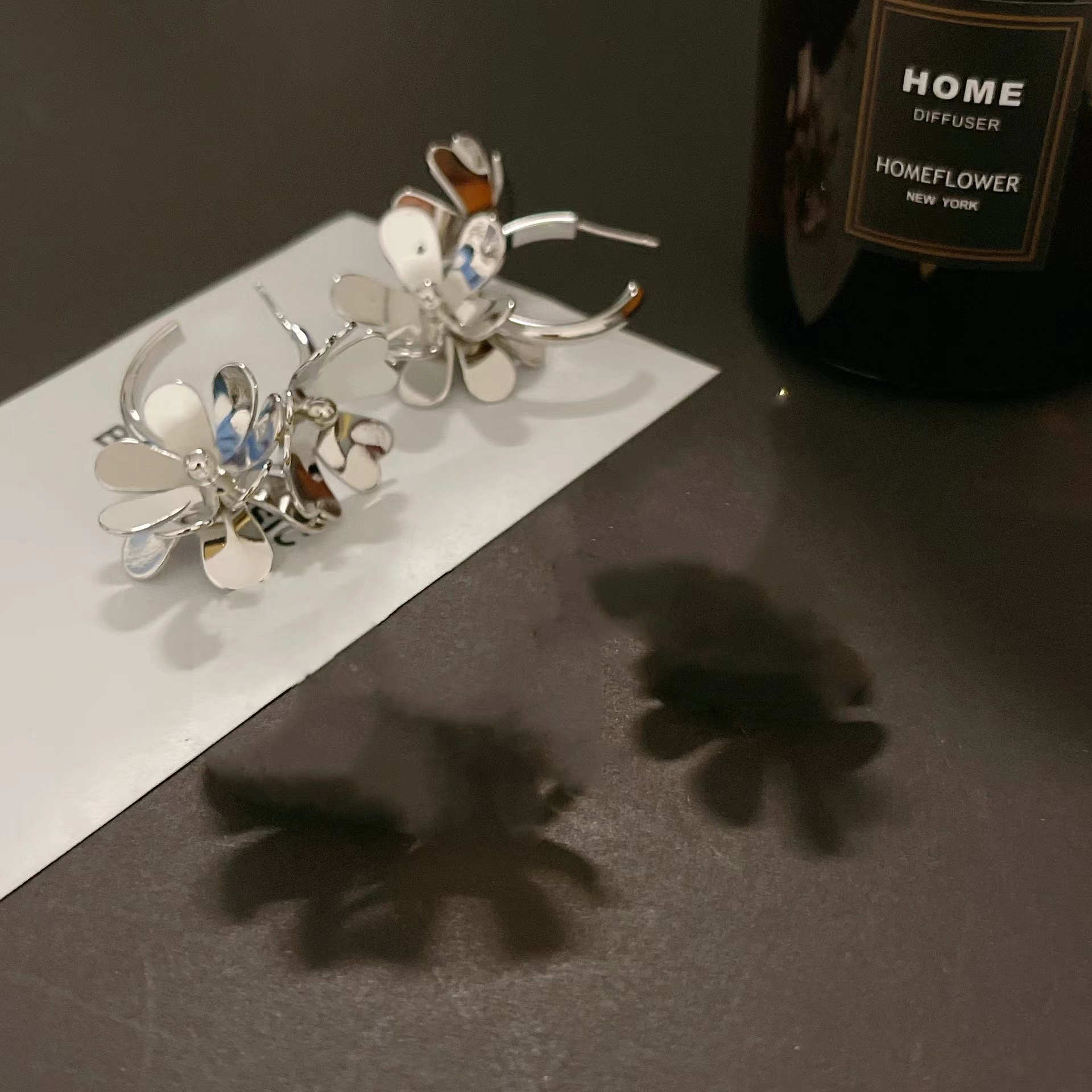 Europe and the United States small design feeling metal wind flower earrings
